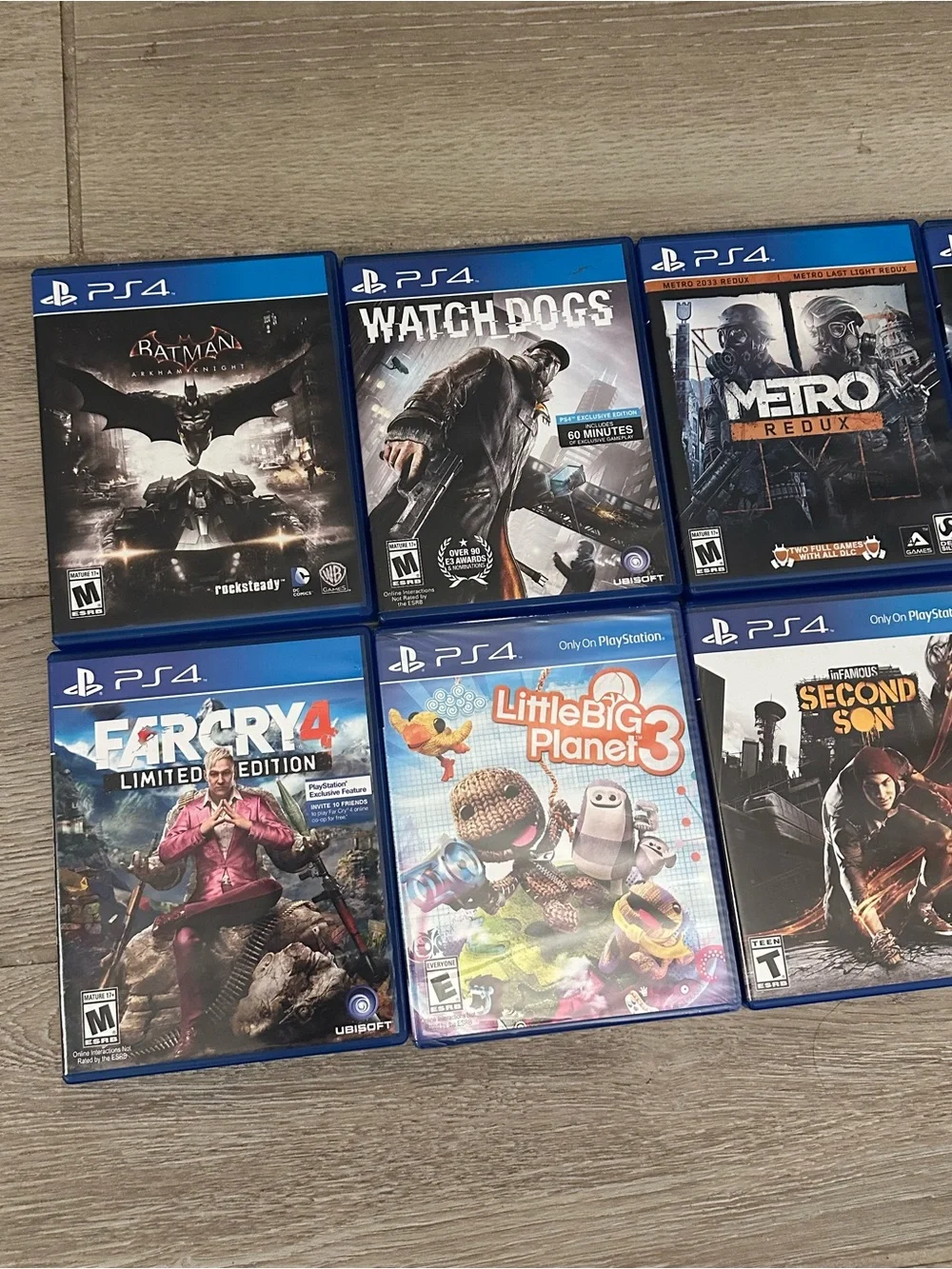 PlayStation 4 Video Games Lot (8) (Watch Dogs, Metro Redux, Batman, Far Cry 4)